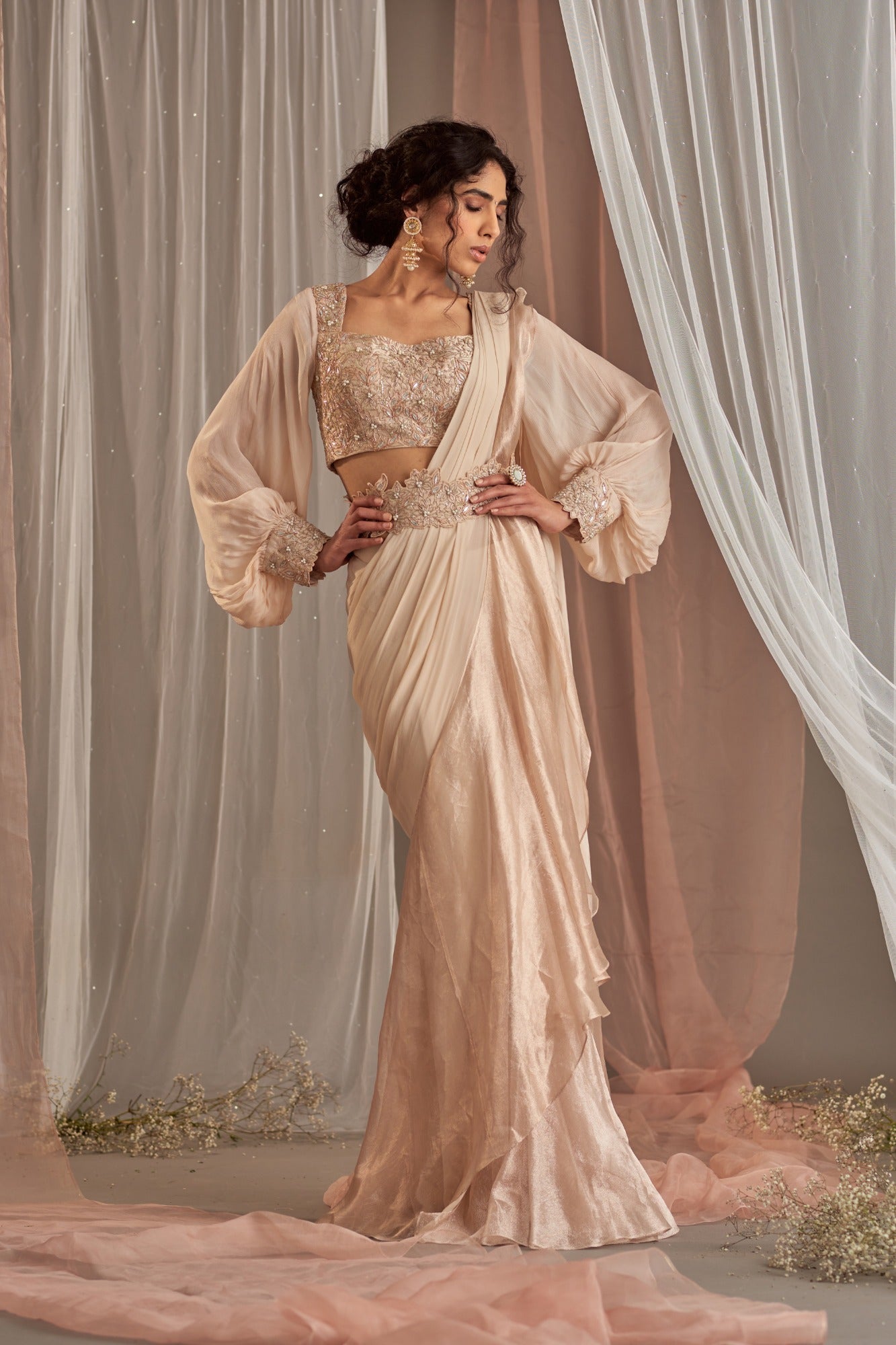 Ivory ruffles saree with pearl embroidered blouse by Ridhi Mehra